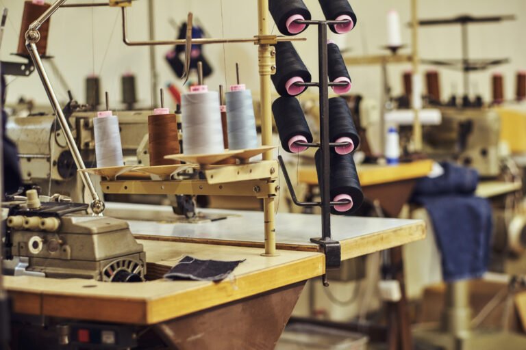 Image of a lot of coils with a threads at the sewing workshop